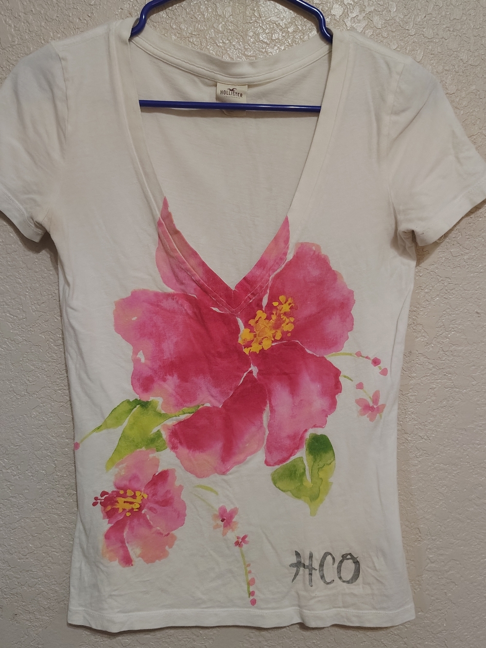 Hollister White V-Neck Tee with Pink Hibiscus Graphic